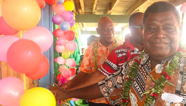 (L to R) Acting Premier for GP, Mr. Peter Aoraonisaka, PS MPGIS, Mr. Stanley Pirione, and Chairperson for Teatupa Primary School Board Mr. Batholomew Vavanga jointly cutting the ribbon to mark the opening of the opening of the classrooms
